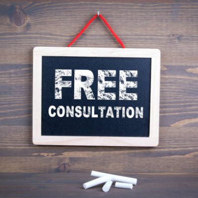 Free Consultation. Business success and customer service concept. Chalkboard on a wooden background