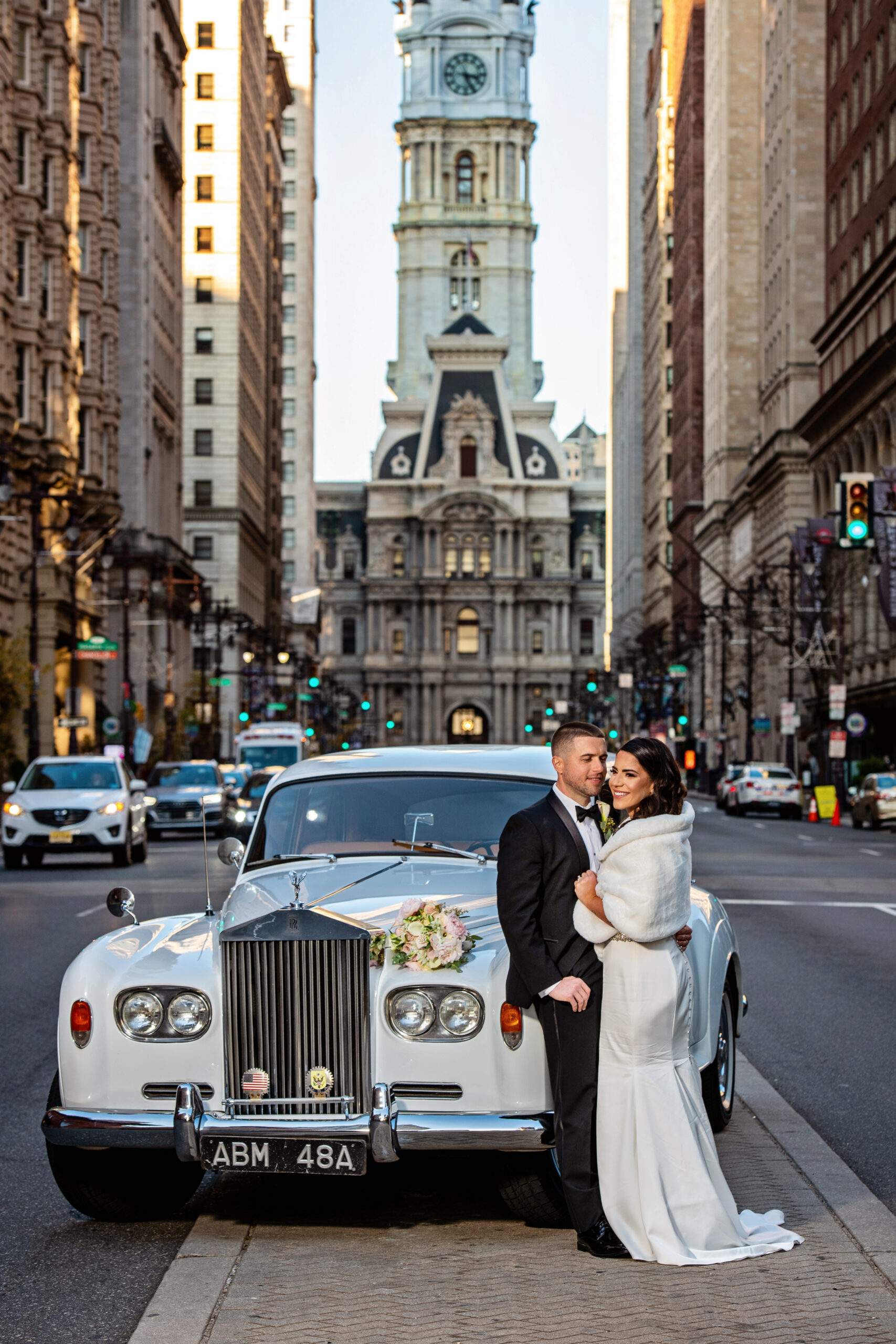 A wedding moment Wedding couple and a classic car on a city street